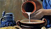 The milk flows from the pitcher into the milk bowl